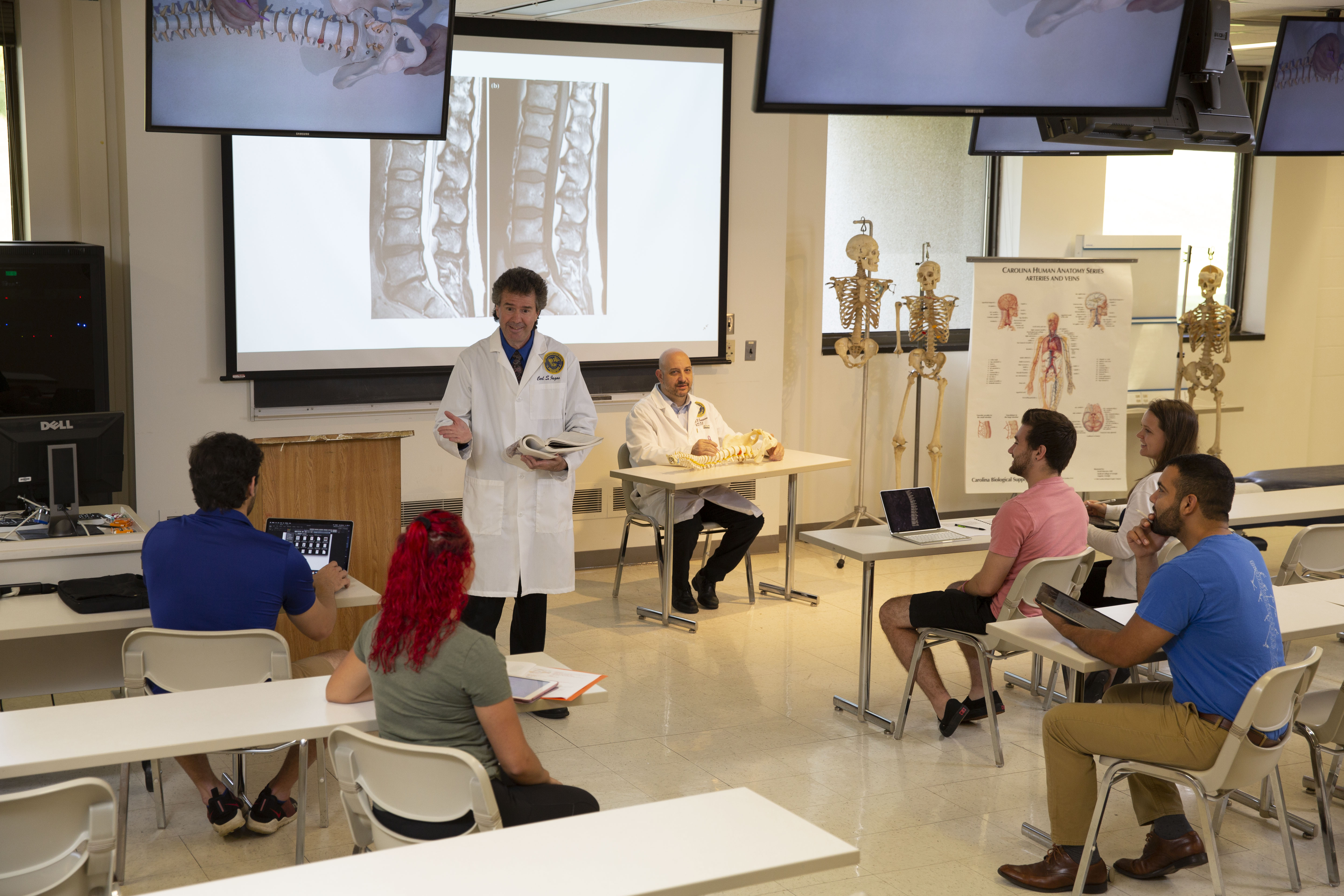 Carl Jagos in the Anatamy Lab lecture room, instructing students